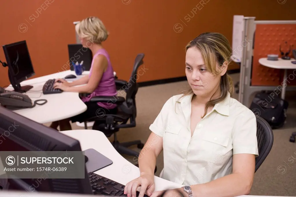 Two businesswomen sitting in an office