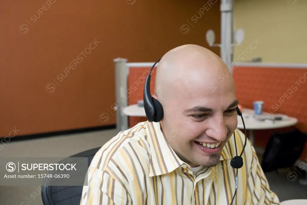 Close-up of a businessman wearing a headset in an office
