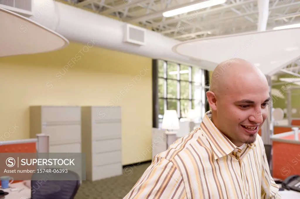 Side profile of a businessman smiling in an office