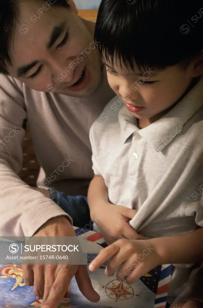 Father helping his son study