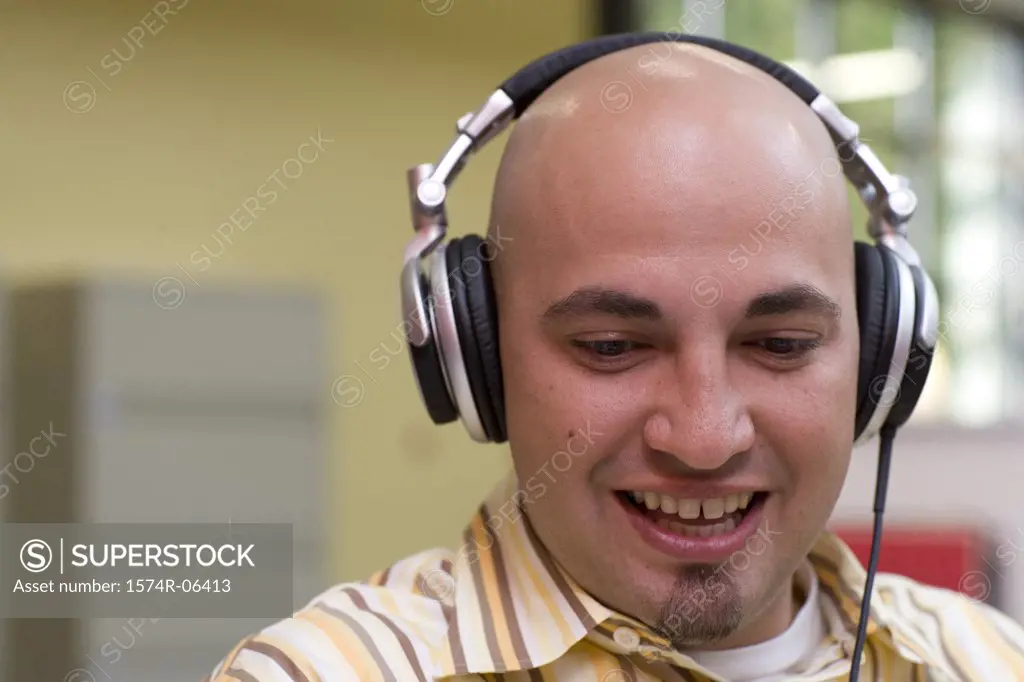 Close-up of a businessman wearing headphones in an office