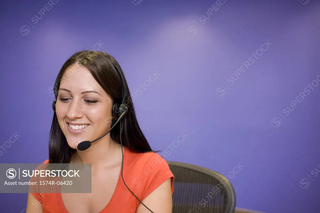 Close-up of a businesswoman wearing a headset in an office