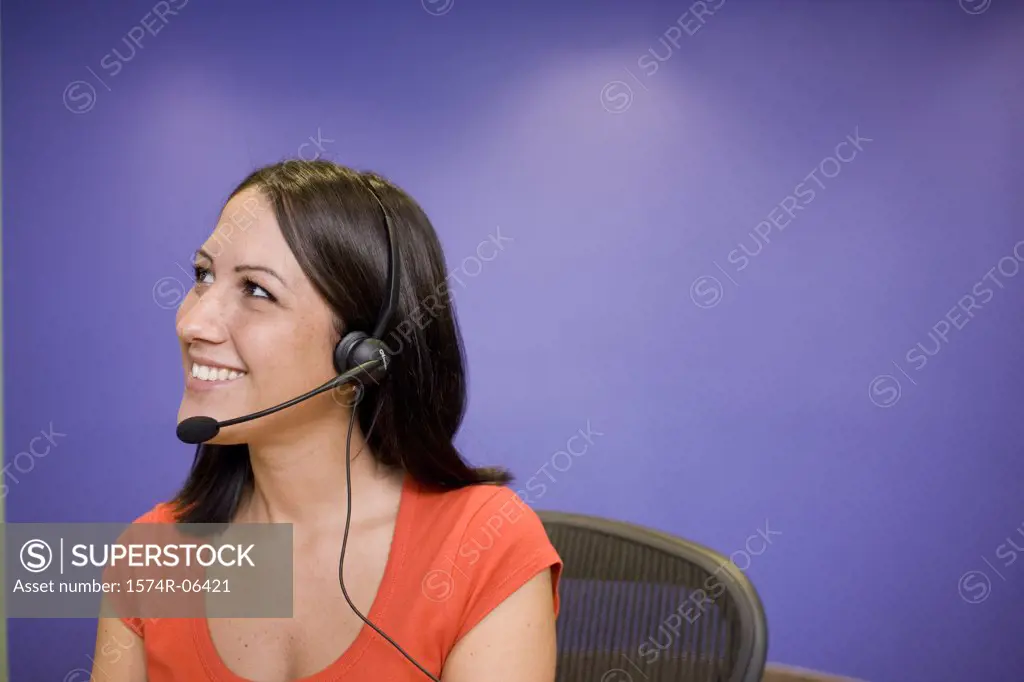 Close-up of a businesswoman wearing a headset in an office