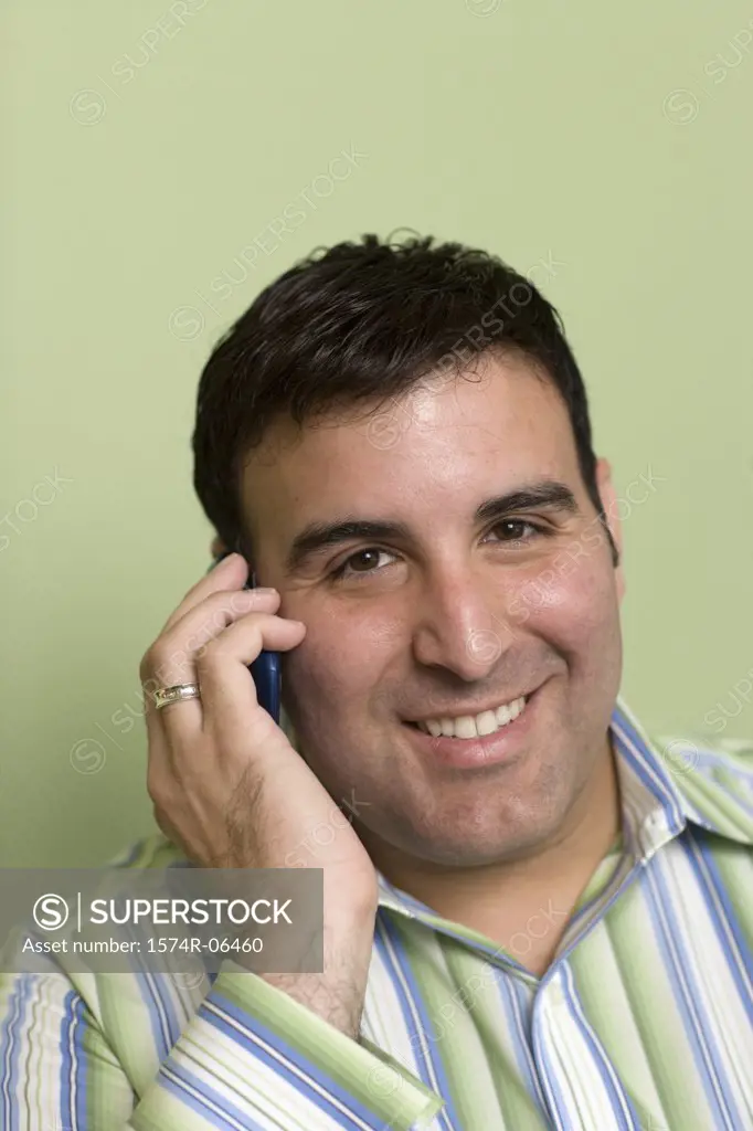 Close-up of a businessman talking on a mobile phone in an office