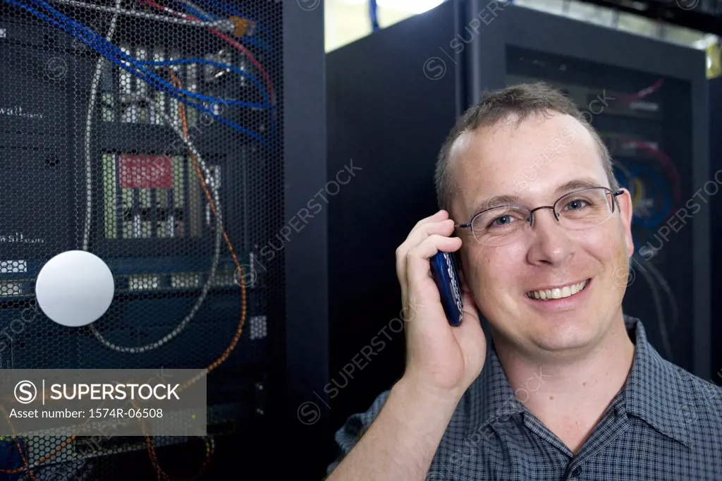 Portrait of a technician talking on a mobile phone