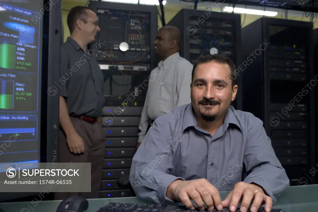 Three technicians in a server room