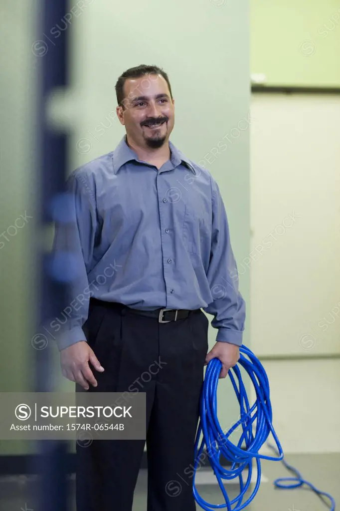 Technician holding computer cables