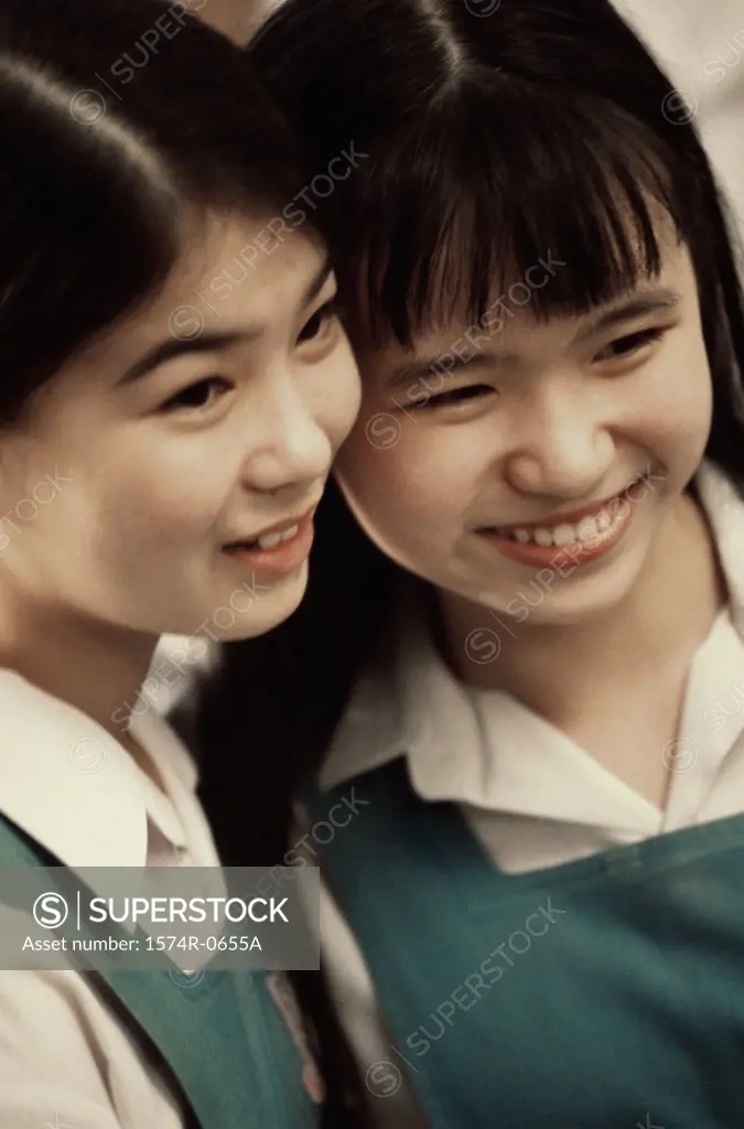 Two teenage girls smiling