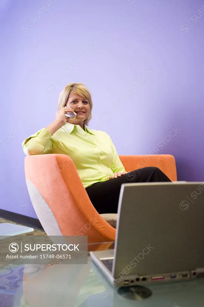 Portrait of a businesswoman talking on a mobile phone in an office