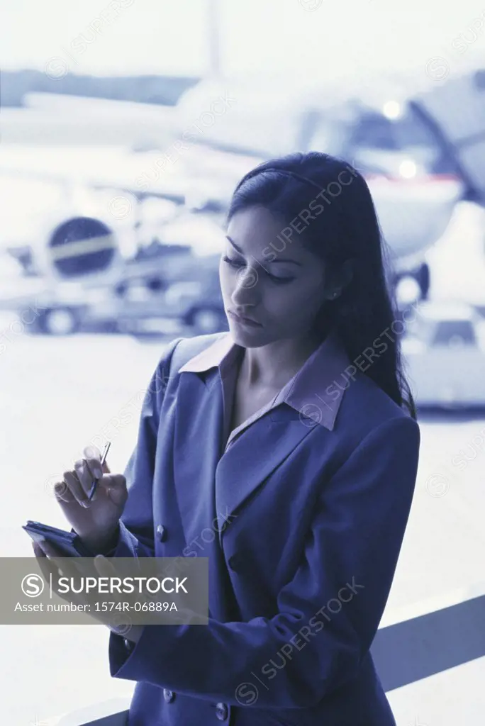 Businesswoman operating a hand held device