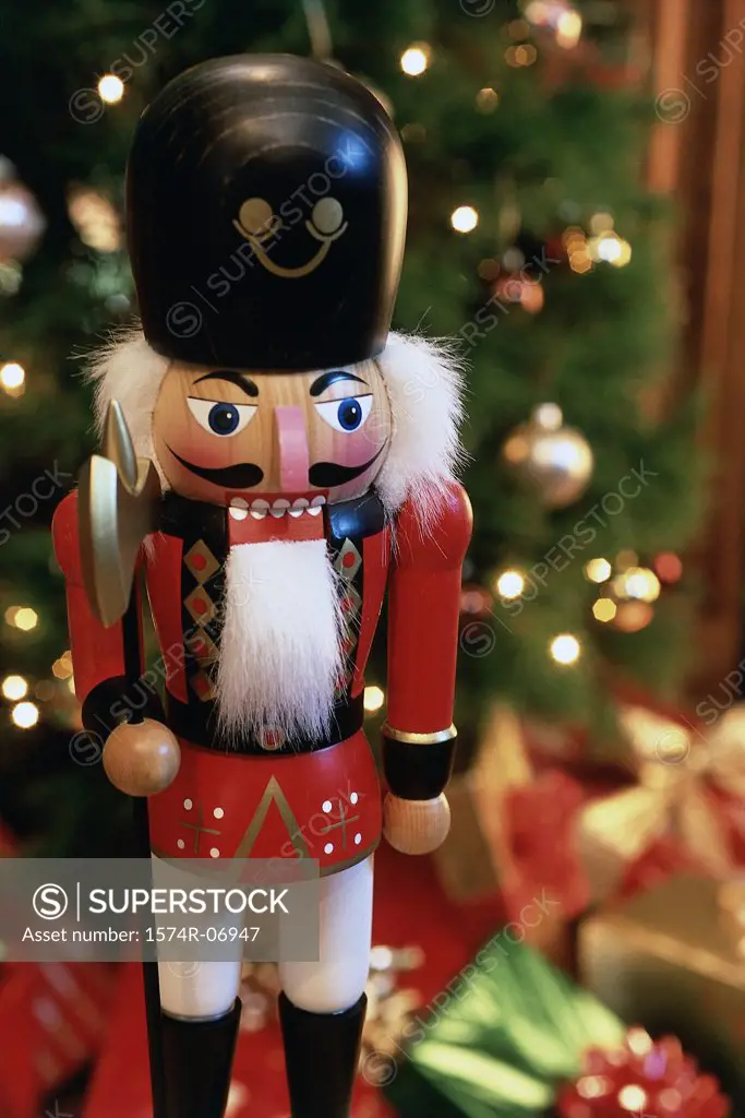 Nutcracker soldier with a Christmas tree in the background