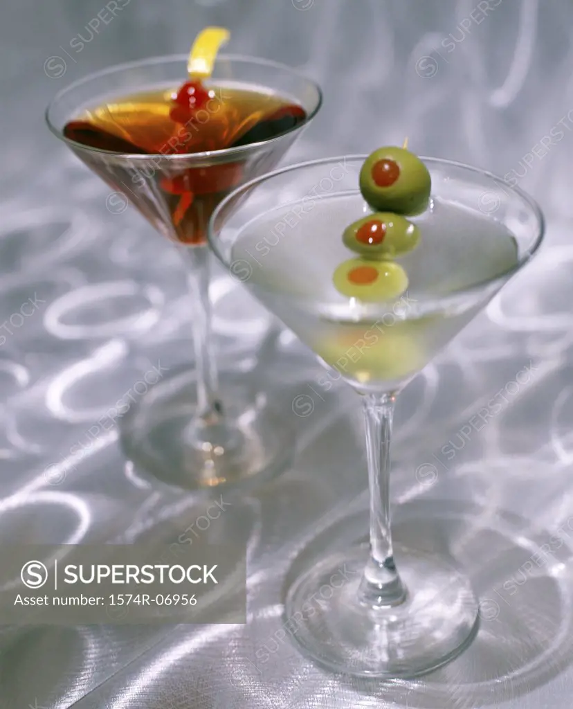 Green olives in martini glasses