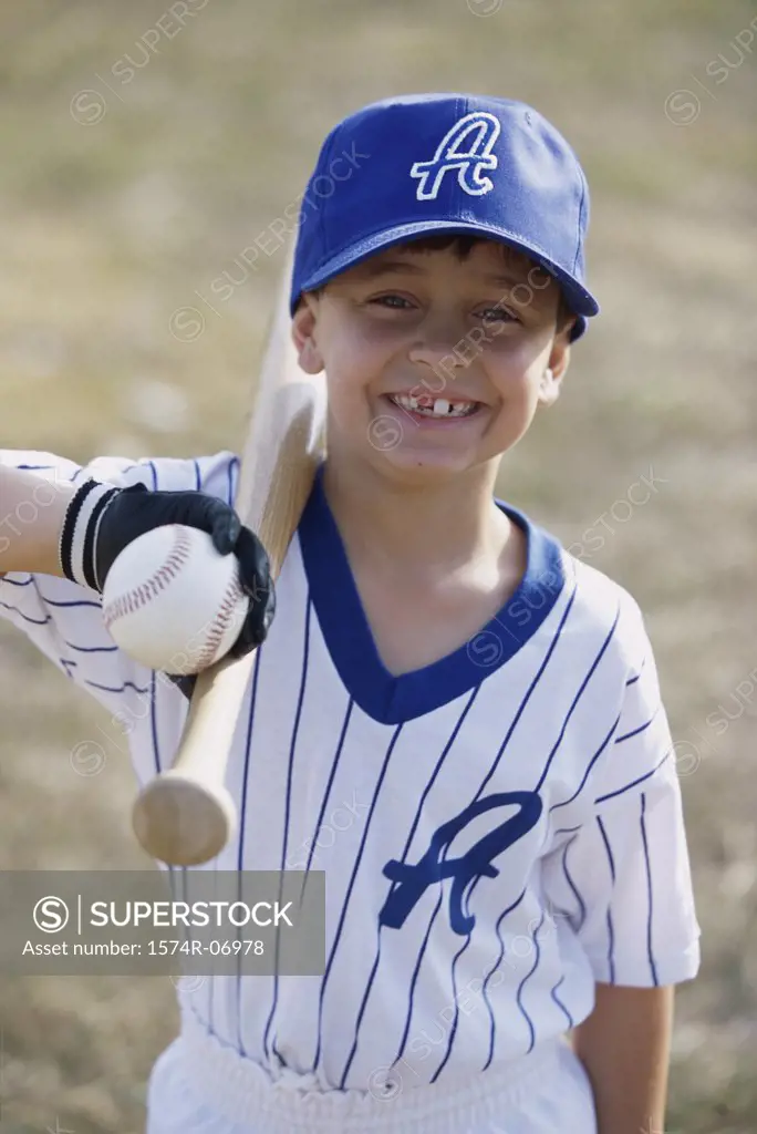 Portrait of a boy holding a baseball bat