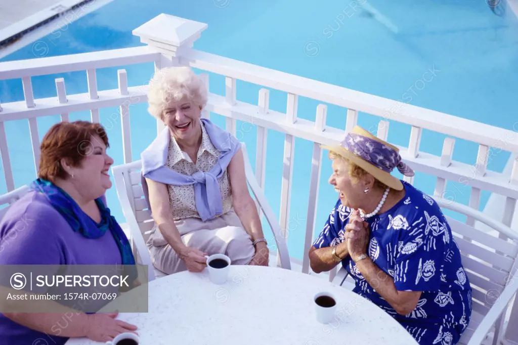 Three senior women sitting together talking