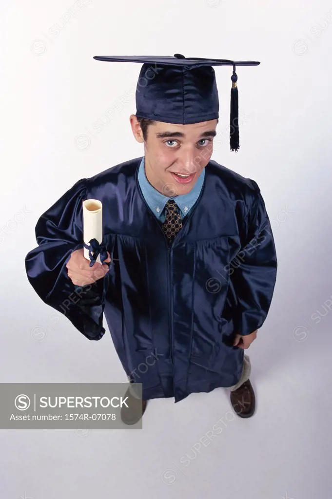 High angle view of a young male graduate holding a diploma