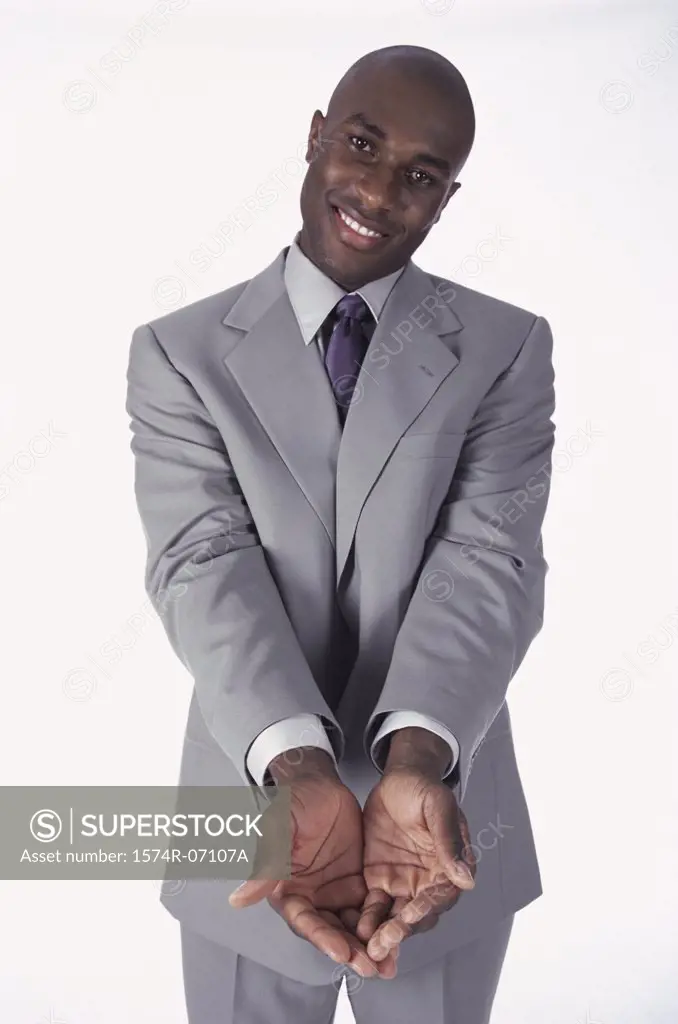Portrait of a businessman with his hands held out