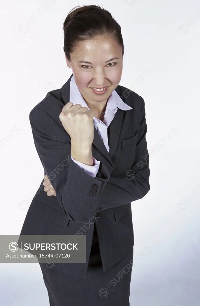 Portrait of a businesswoman showing her fist
