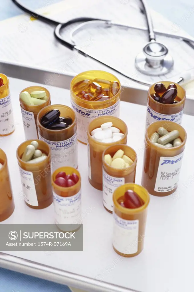 Stethoscope and vials of pills