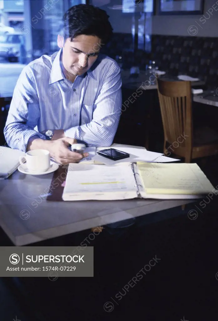 Businessman operating a mobile phone