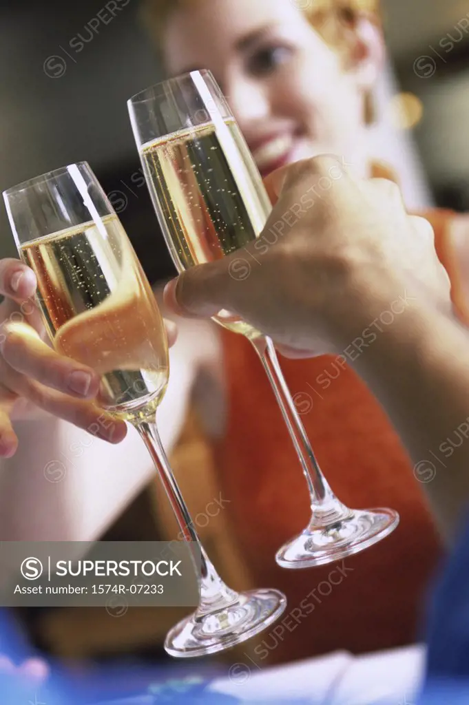 Young couple toasting with Champagne