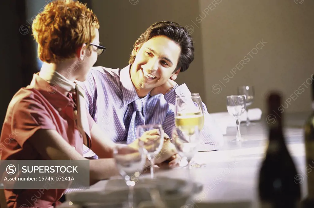 Businessman and a businesswoman sitting in a restaurant