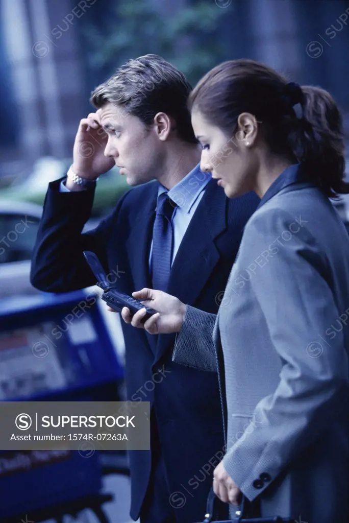 Side profile of a businessman and a businesswoman