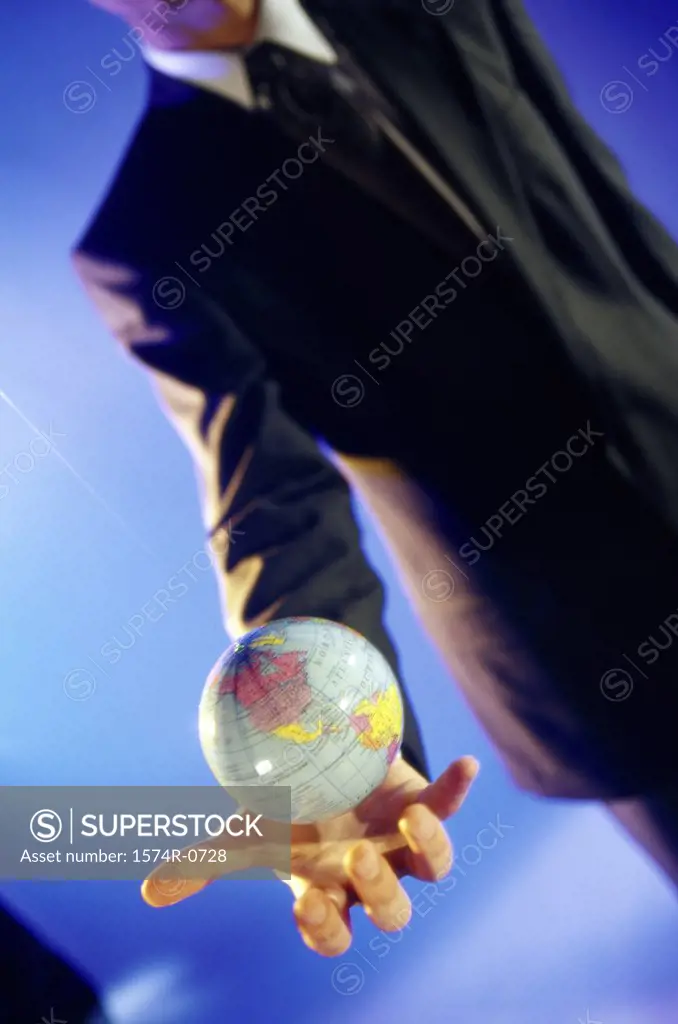 Businessman holding a globe