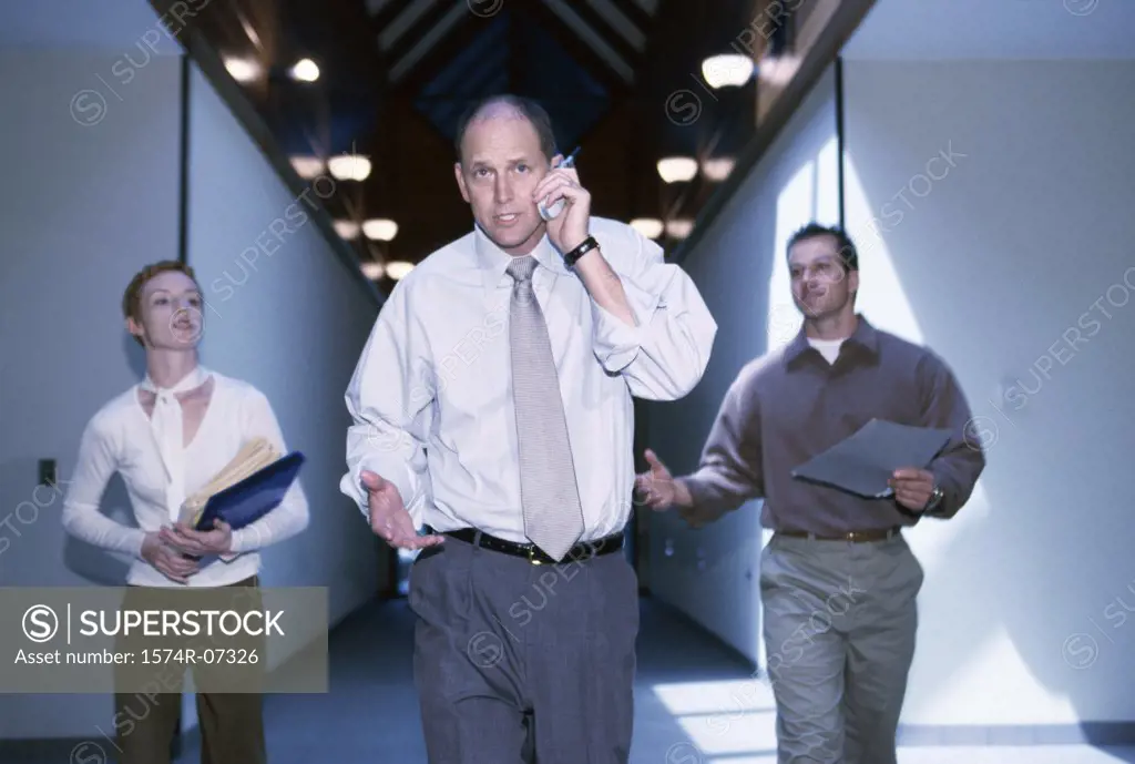 Portrait of a businesspeople walking in a corridor