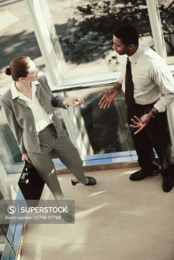 High angle view of a businessman and a businesswoman talking