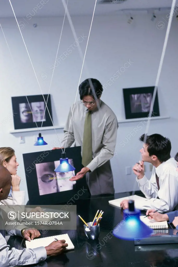 Business executives at a presentation in a conference room
