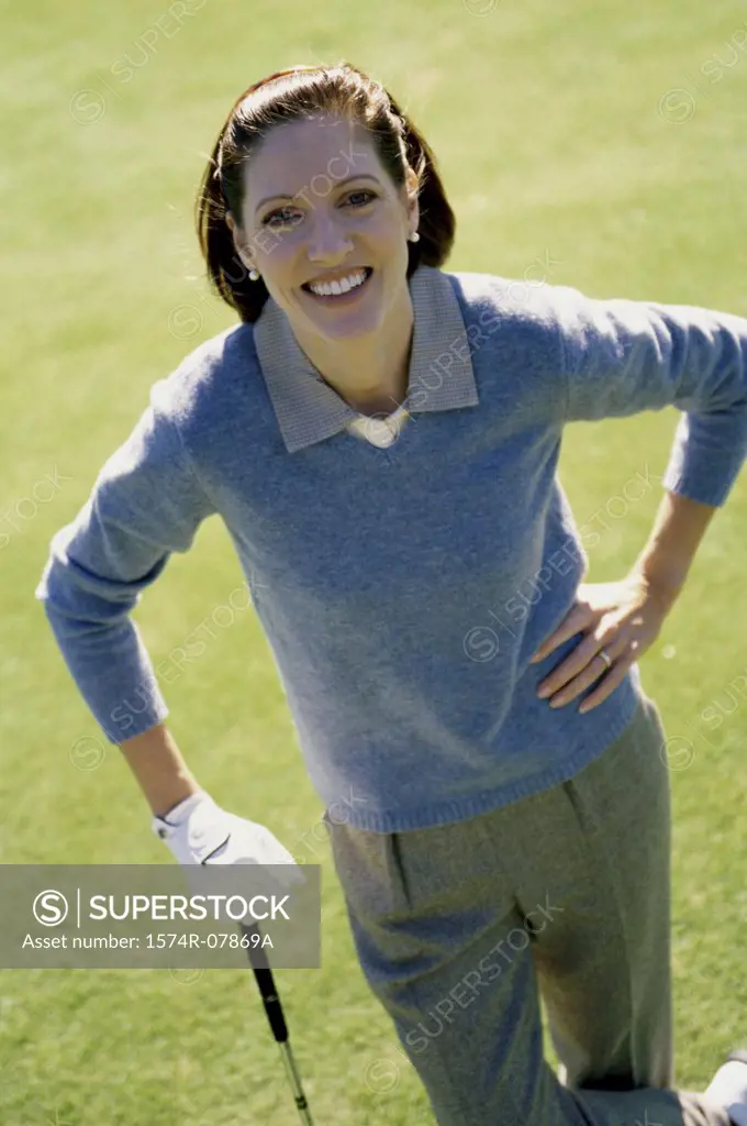 Portrait of a mid adult woman standing on a golf course