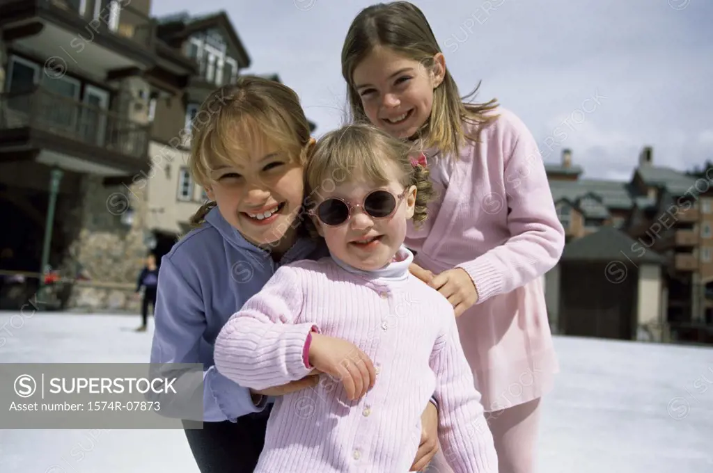 Portrait of three girls smiling