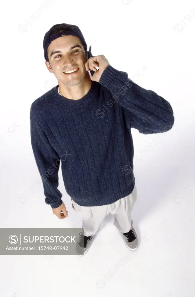 High angle view of a young man talking on a mobile phone