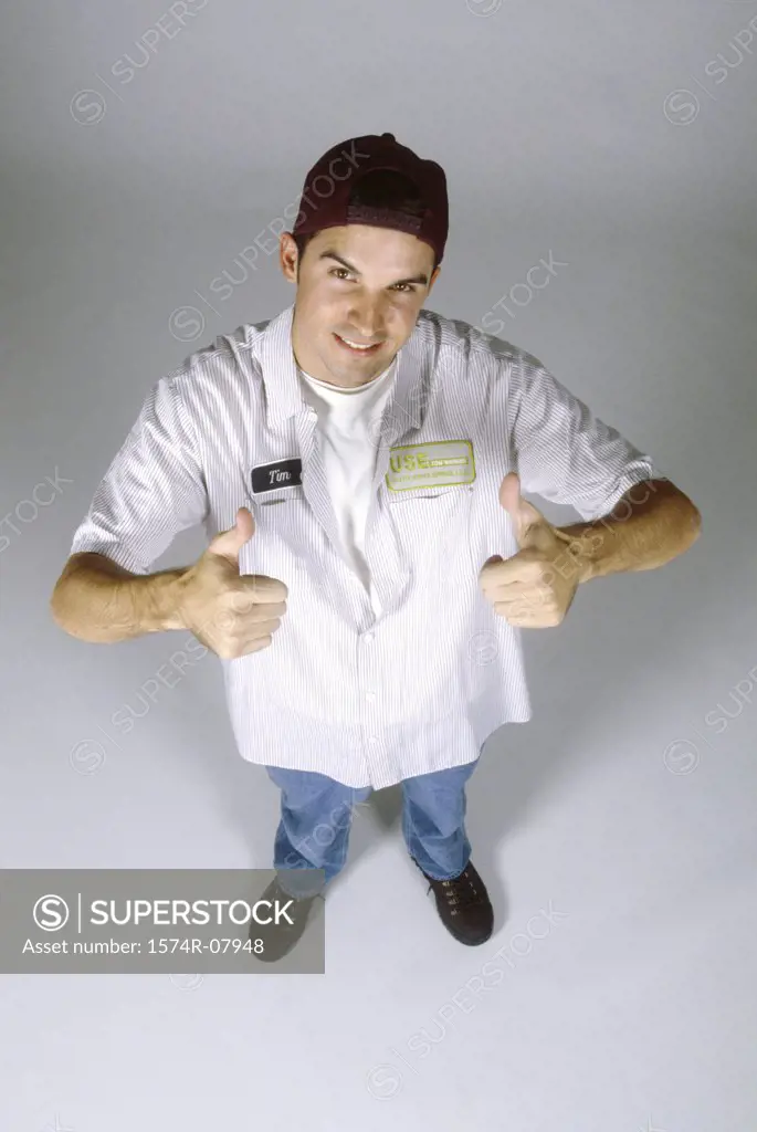 Portrait of a mechanic showing thumbs up