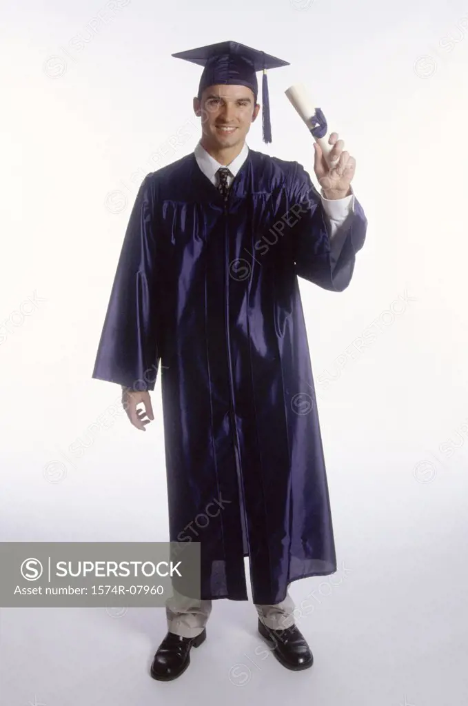Young male graduate holding a diploma