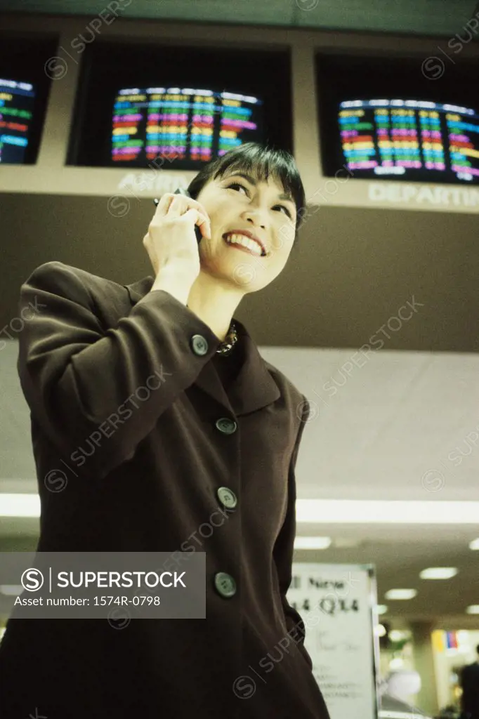 Low angle view of a businesswoman talking on a mobile phone