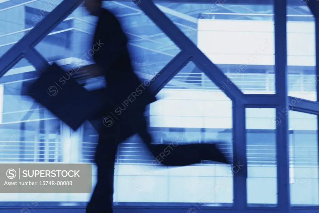 Side profile of a businessman running