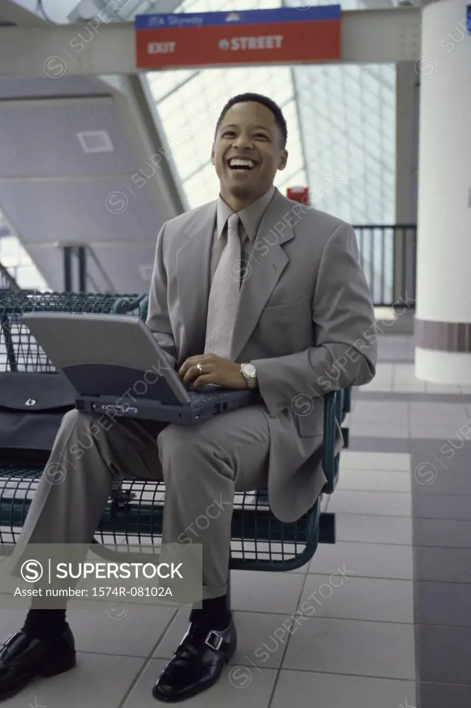 Portrait of a businessman working on a laptop