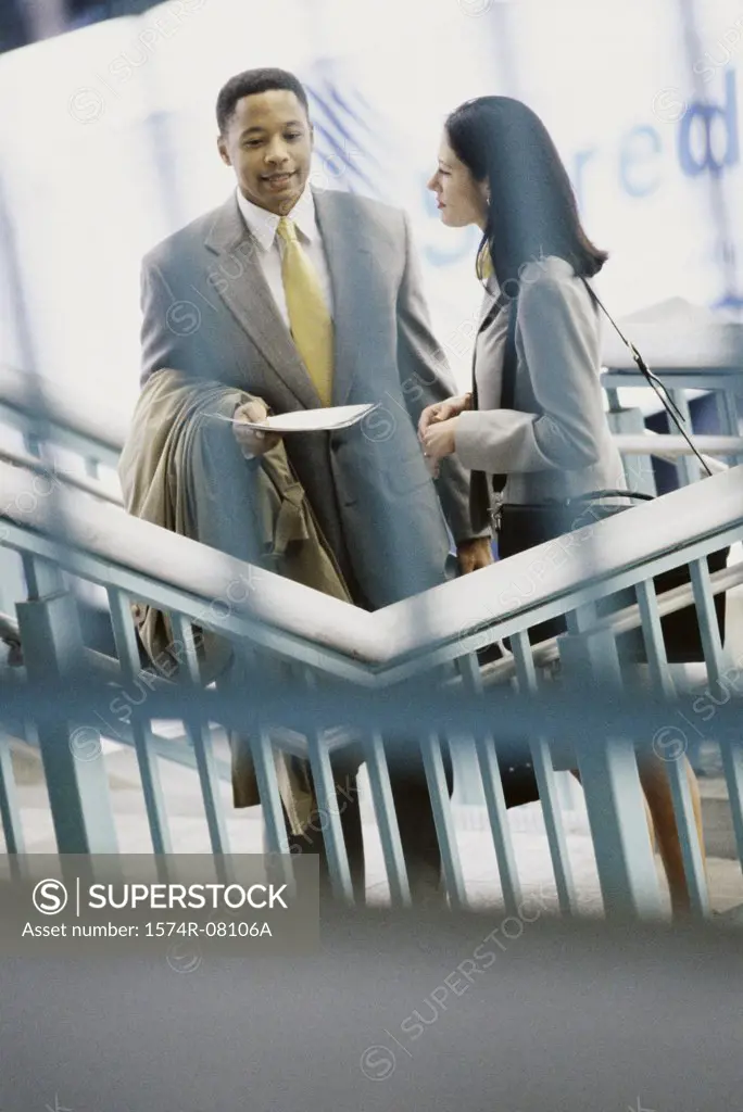 High angle view of a businessman and a businesswoman talking