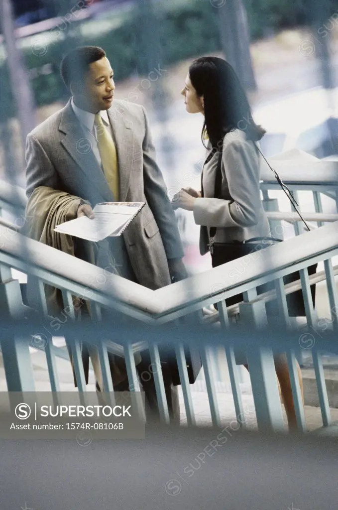 High angle view of a businessman and a businesswoman face to face