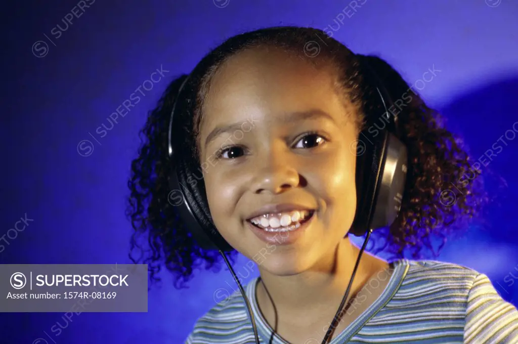 Portrait of a girl listening to music with headphones