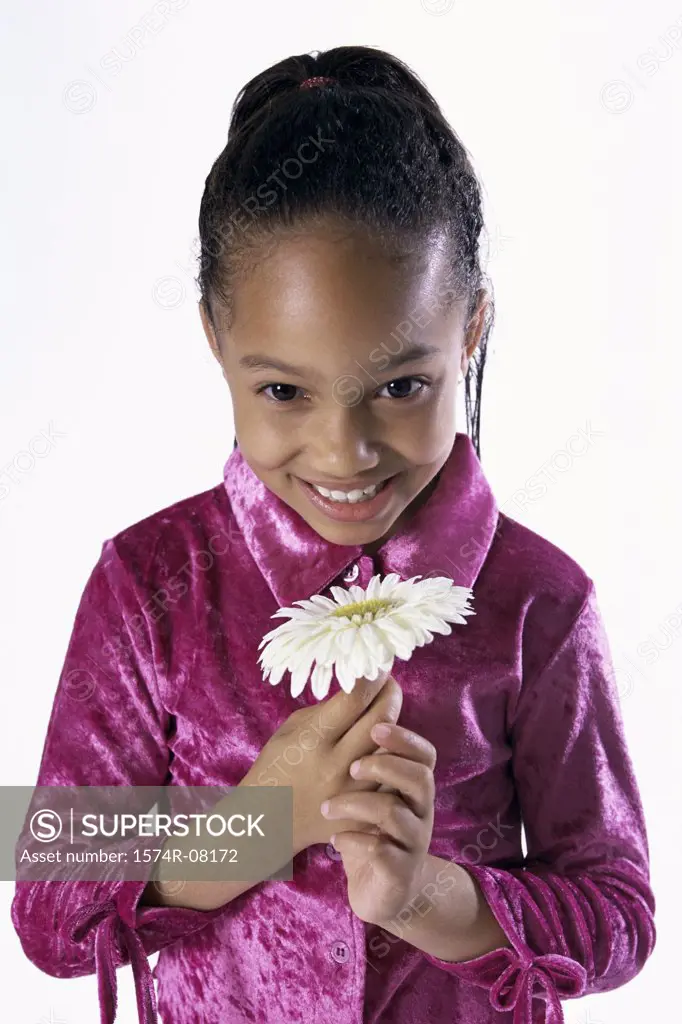 Portrait of a girl holding a flower