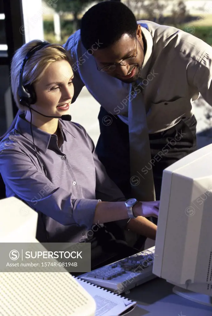 Two customer service representatives discussing