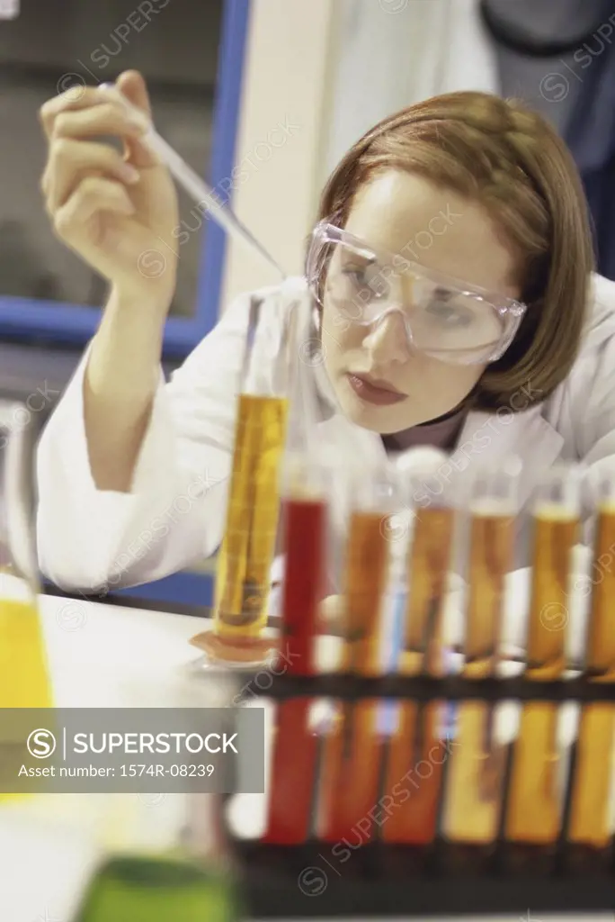 Female researcher working with chemicals