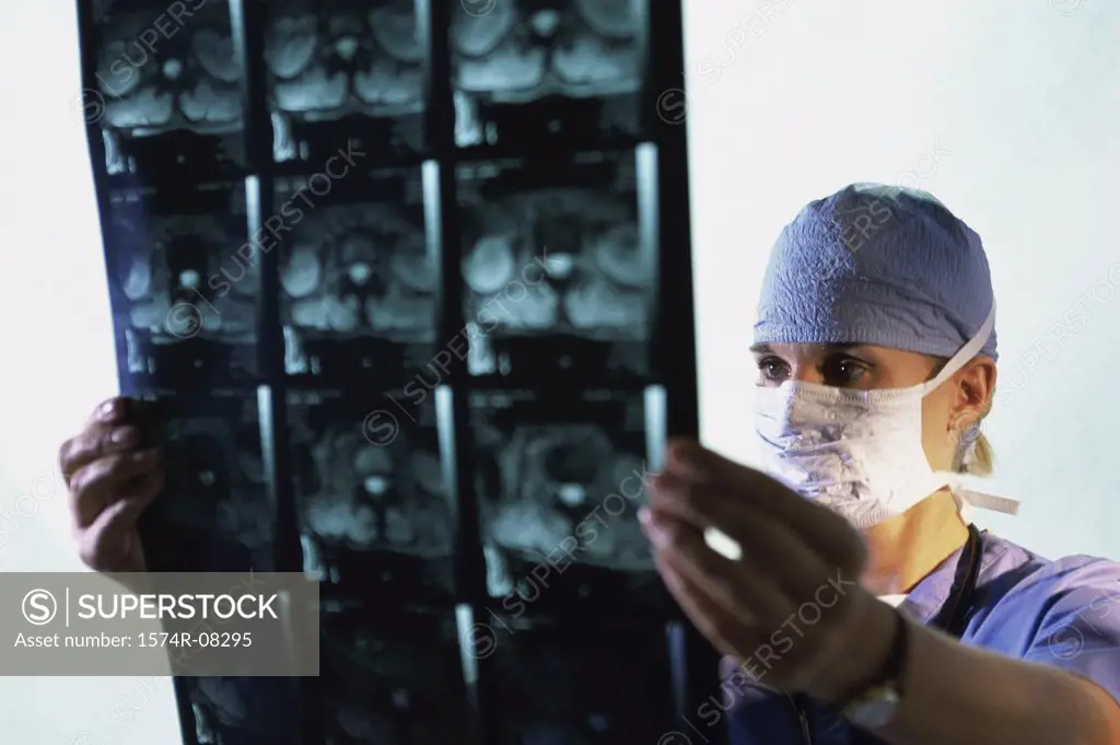 Male doctor examining an X-ray film