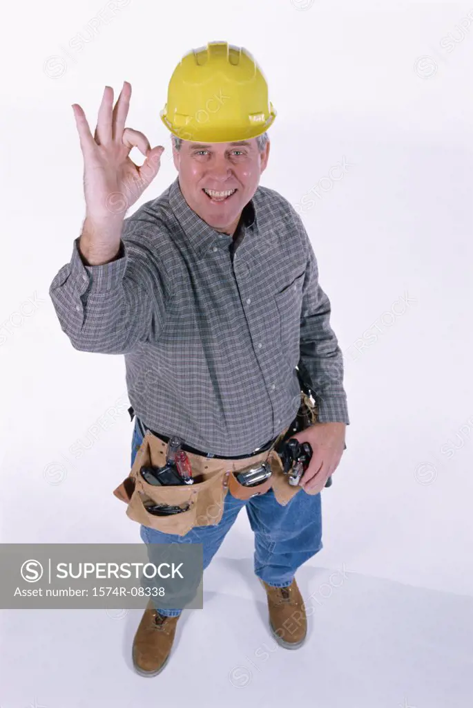 Portrait of a construction worker gesturing ok sign with his hand