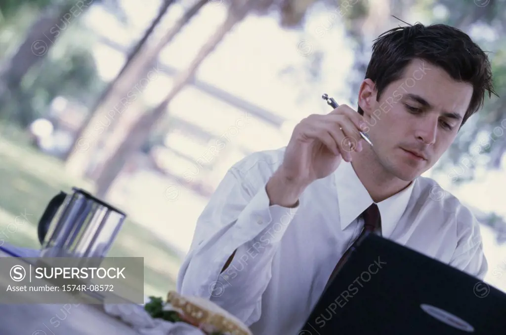 Businessman sitting in front of a laptop