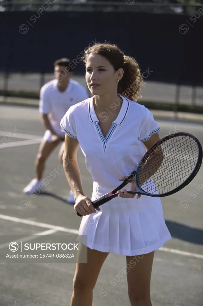 Young couple playing tennis