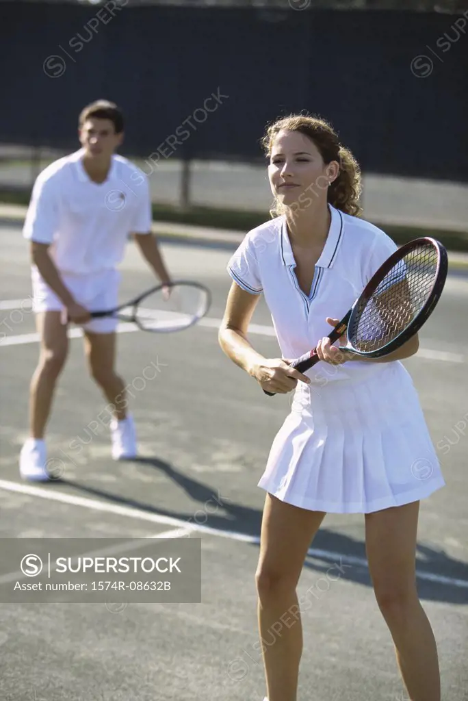 Young couple playing tennis