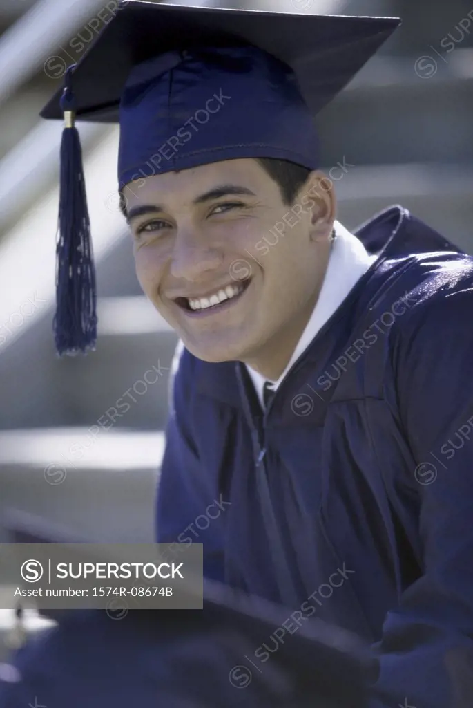 Portrait of a young male graduate smiling